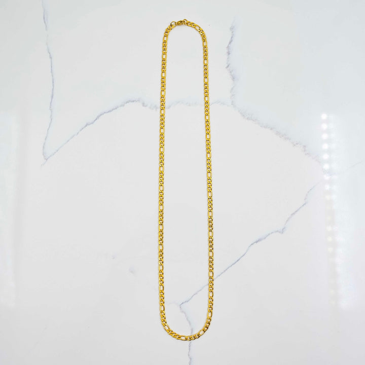 Figaro Chain - Gold on White Marble