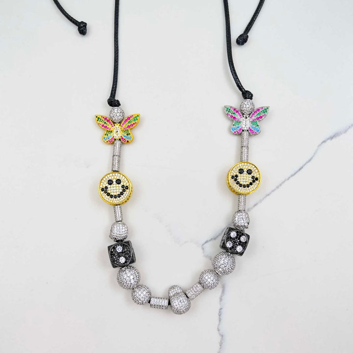 Iced Smiley Pearl Necklace on White Marble