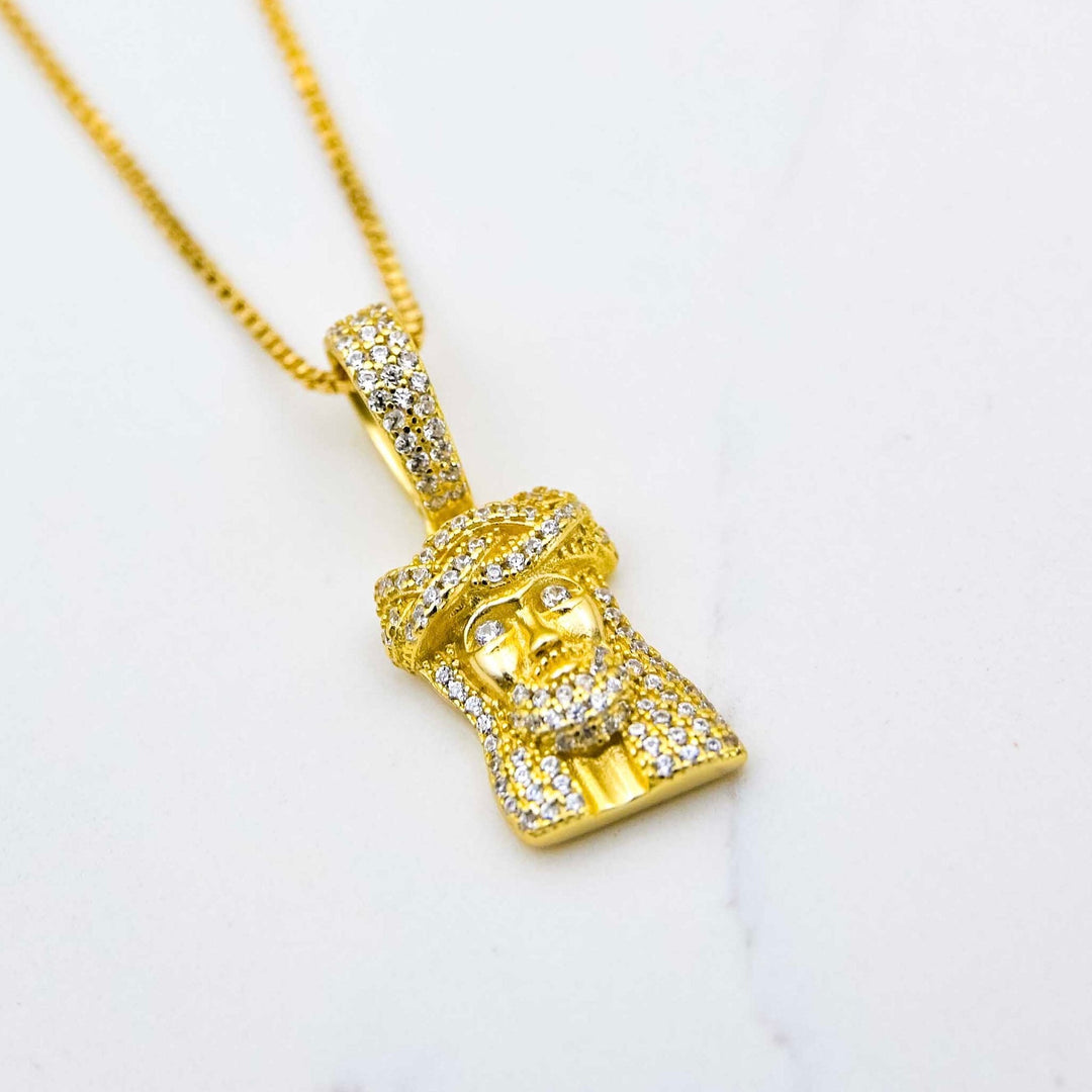 Micro Jesus Piece (925 Sterling Silver) - Yellow Gold on White Marble