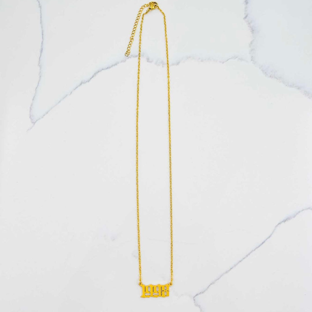 1998 Nameplate Necklace - Gold on White Marble