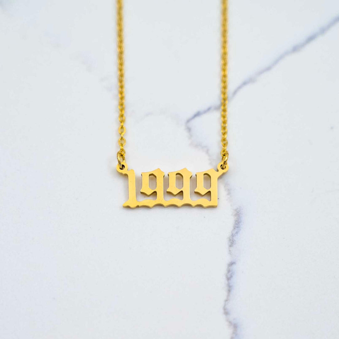 1999 Nameplate Necklace - Gold on White Marble