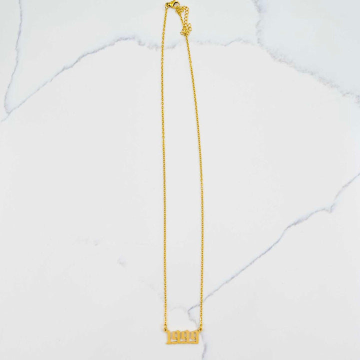 1999 Nameplate Necklace - Gold on White Marble